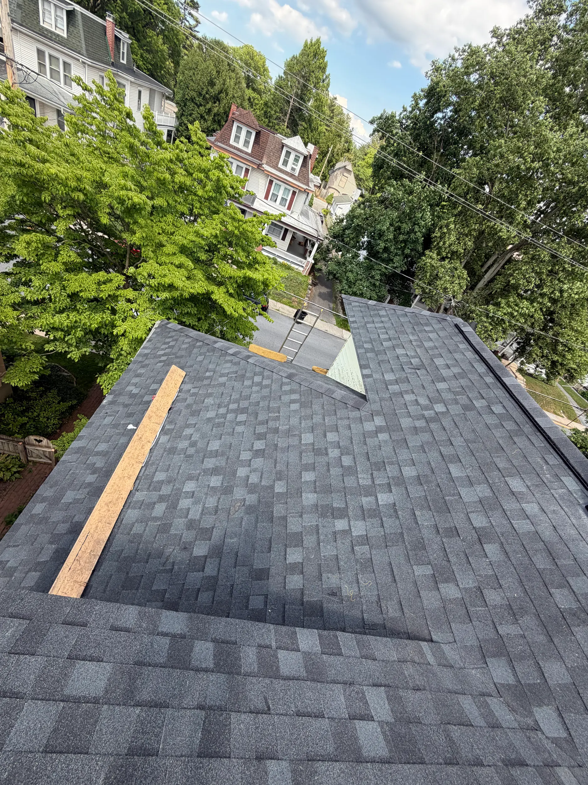 Brand-new charcoal architectural shingle roof installed by Quietstorm Exteriors in a Lancaster County neighborhood